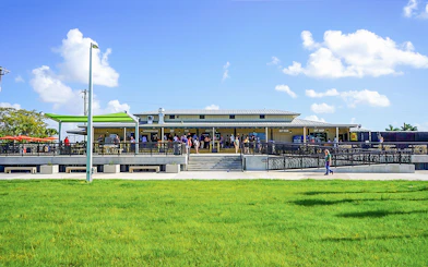 Holiday Park entrance with visitors gathering for airboat tour and wildlife show.