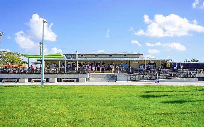 Holiday Park entrance with visitors gathering for airboat tour and wildlife show.
