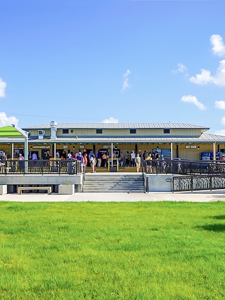 Holiday Park entrance with visitors gathering for airboat tour and wildlife show.