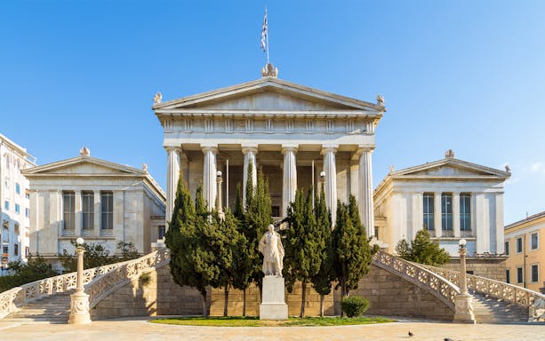 Neoclassical building with columns in Athens, Greece, seen on Hop-on Hop-off tour.