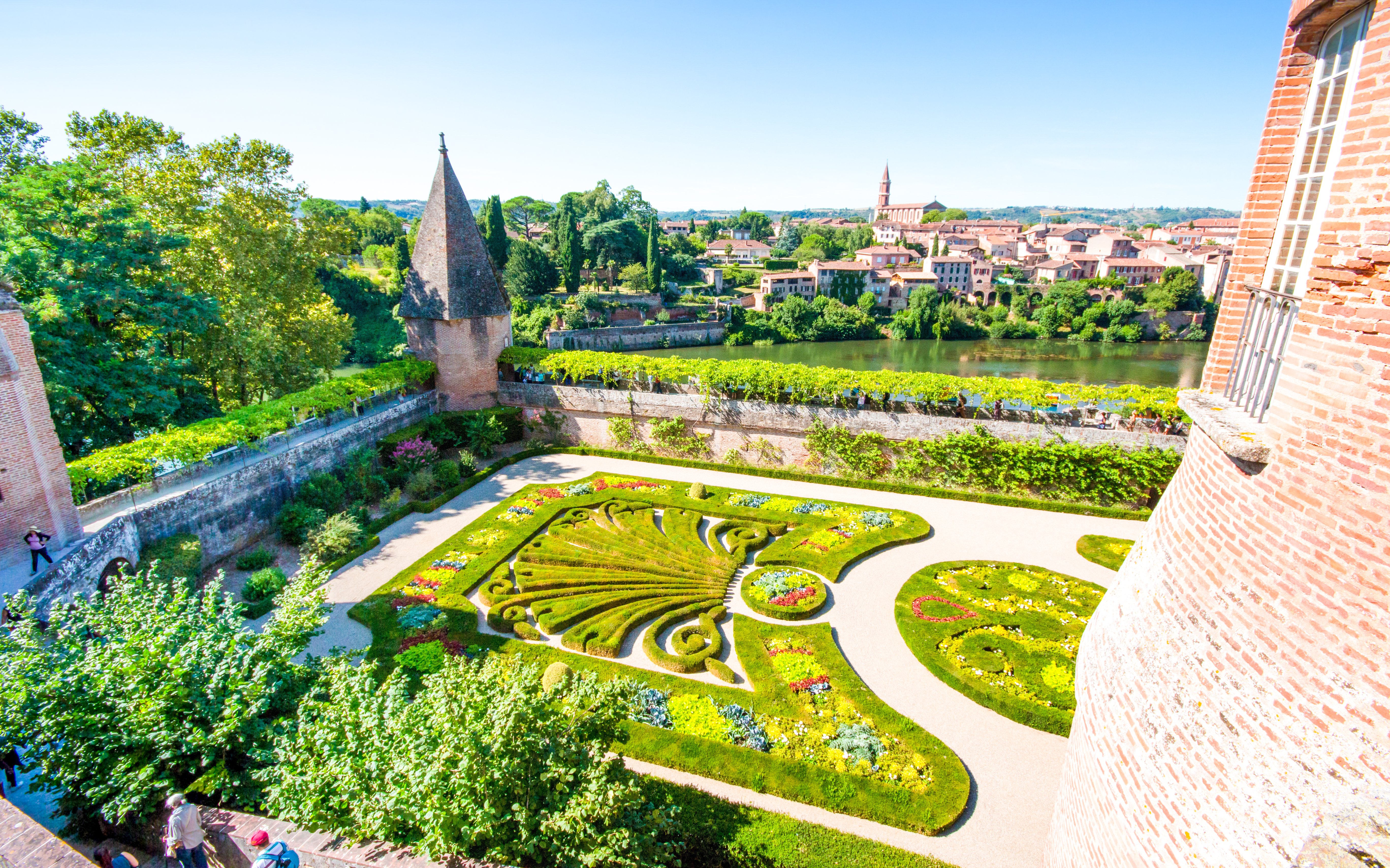 Parc Balbi Versailles Gardens with intricate hedges and vibrant flower beds.