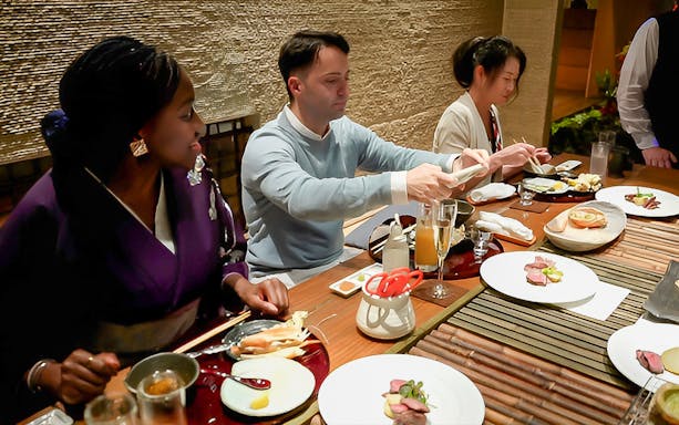 Guests enjoying a multi-course Japanese meal at Kiyoyasu House.