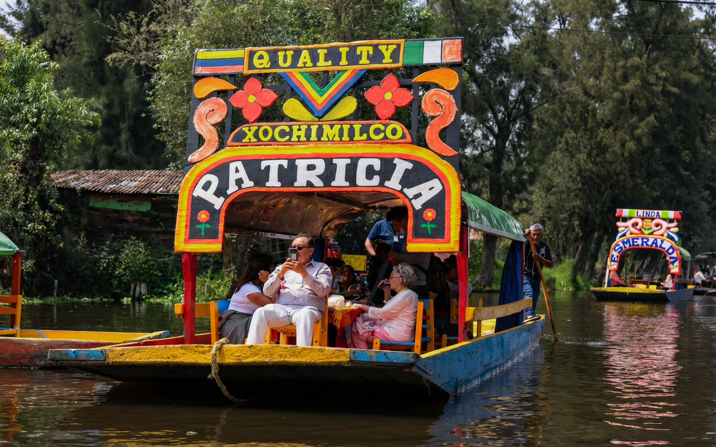 Xochimilco trajinera with tourists enjoying a canal ride in Mexico City.
