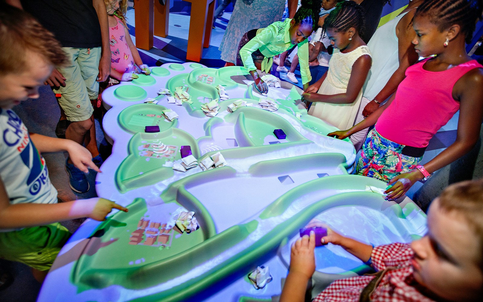 Children interacting with a hands-on exhibit at NEMO Science Museum.