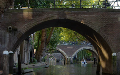 Canal view with arched bridges in Utrecht during a small-group walking tour.
