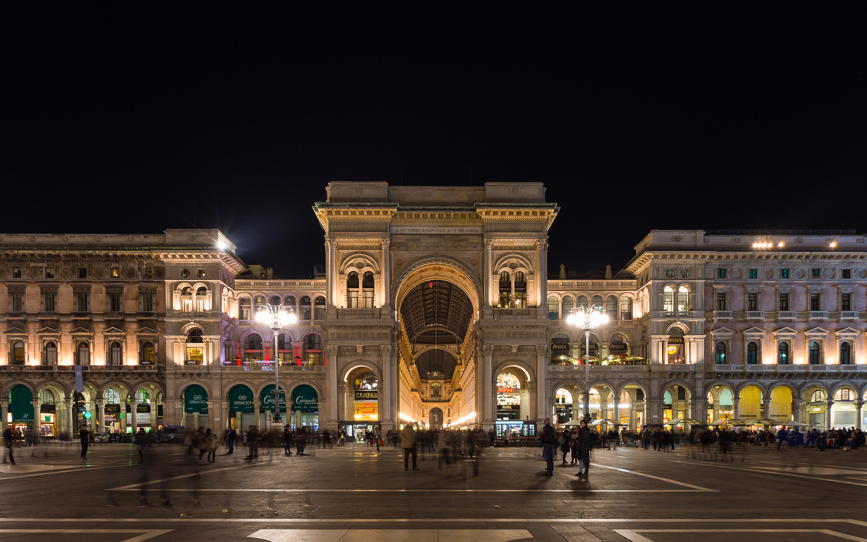 Galleria Vittorio Emanuele II illuminated at night in Milan, Italy.
