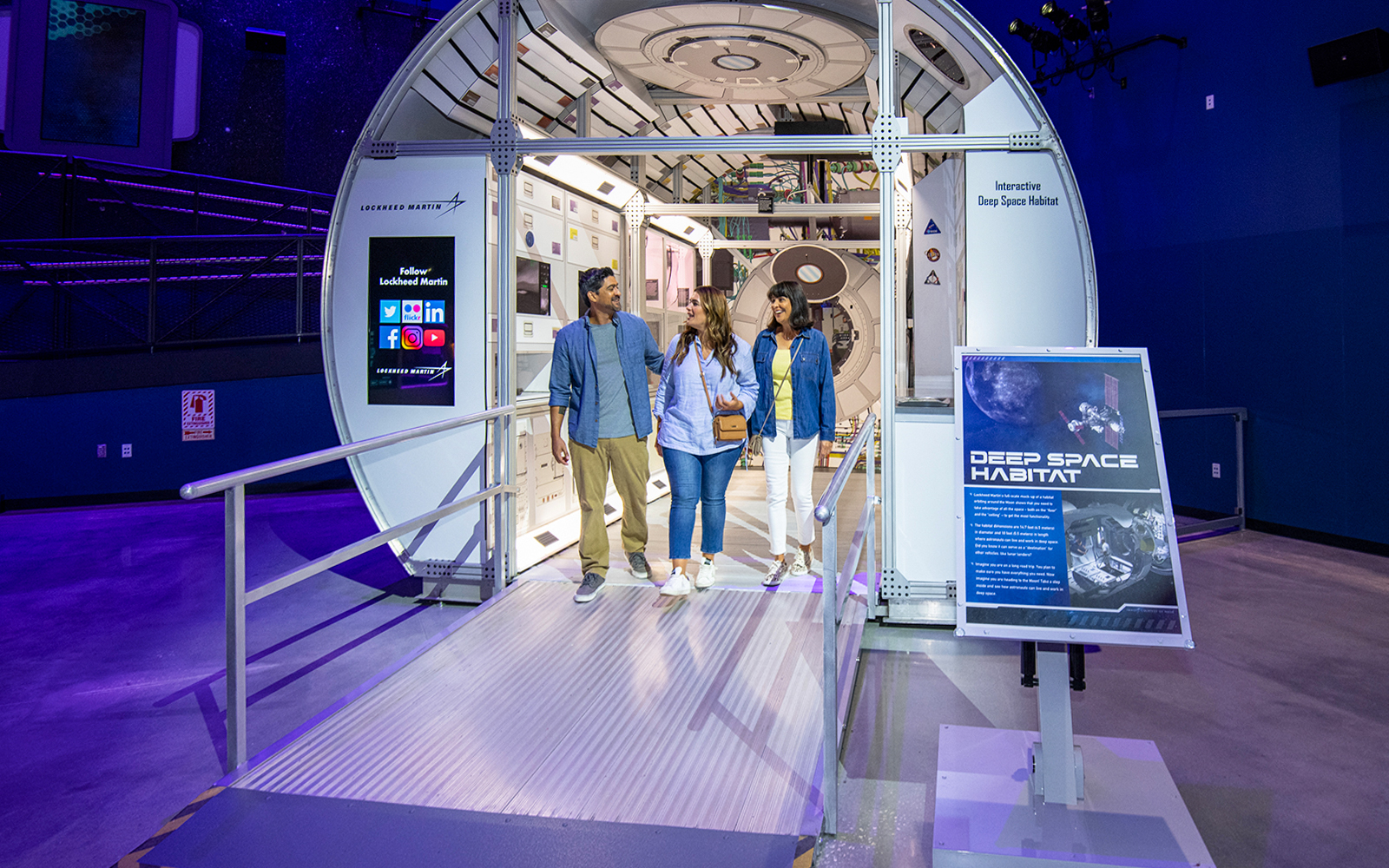 Visitors exploring the Deep Space Habitat exhibit at Kennedy Space Center.
