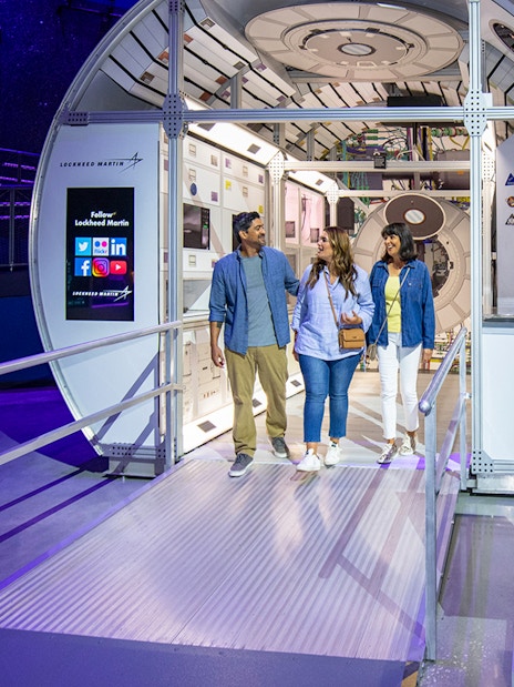 Visitors exploring the Deep Space Habitat exhibit at Kennedy Space Center.