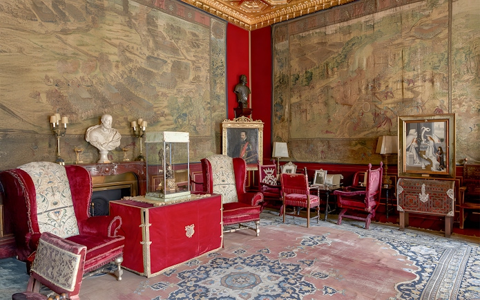Royal artworks and furnishings in Liria Palace's ornate room.