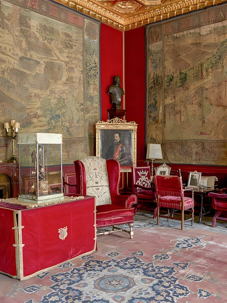 Royal artworks and furnishings in Liria Palace's ornate room.