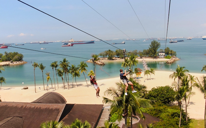 Ziplining over Sentosa Beach at Mega Adventure Park, Singapore.