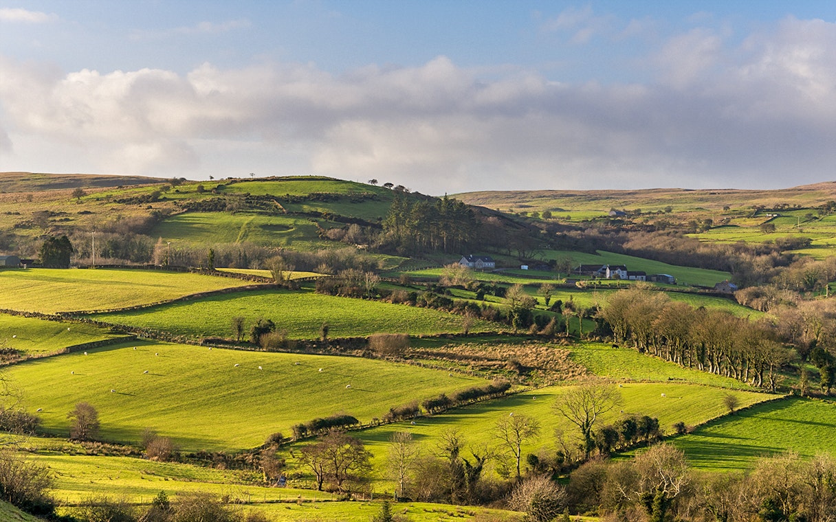 Rolling green hills in Northern Ireland, a filming location for Game of Thrones near Belfast.