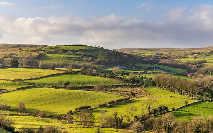 Rolling green hills in Northern Ireland, a filming location for Game of Thrones near Belfast.