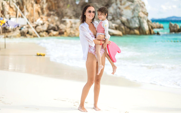 Mother and child enjoying the beach on the Phi Phi Islands tour, Phuket.