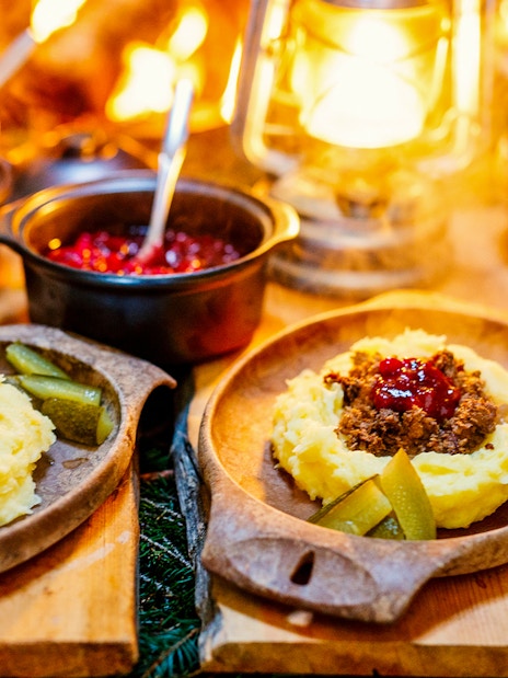 Traditional Finnish meal with mashed potatoes and lingonberry sauce at Santa Claus Village, Rovaniemi.