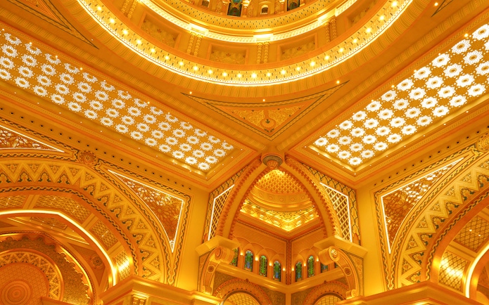 Ornate ceiling details of Qasr Al Watan in Abu Dhabi, showcasing intricate patterns and arches.