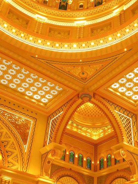 Ornate ceiling details of Qasr Al Watan in Abu Dhabi, showcasing intricate patterns and arches.