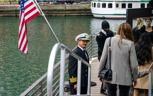 Captain greeting guests on a Chicago river cruise deck.