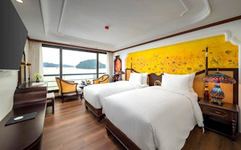 Luxury cabin with twin beds and bay view on Ha Long Bay 5-Star Premium Cruise.