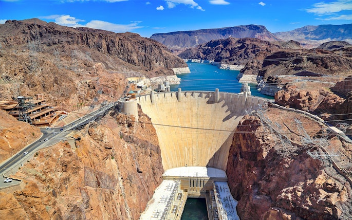 Hoover Dam with surrounding canyon and reservoir on exploration tour.