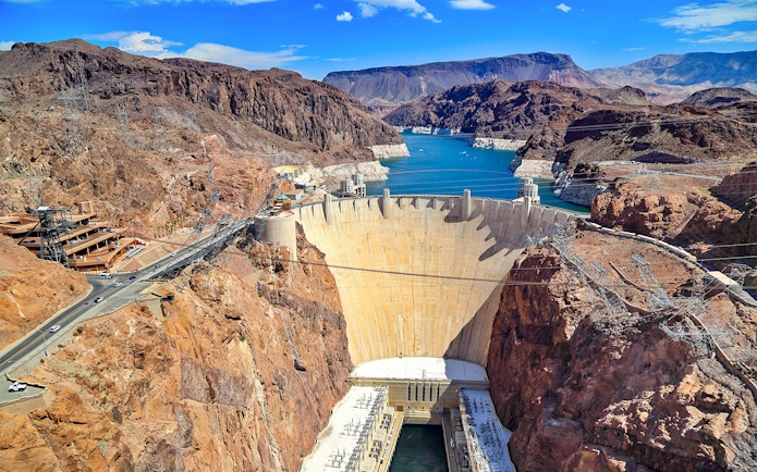 Hoover Dam with surrounding canyon and reservoir on exploration tour.