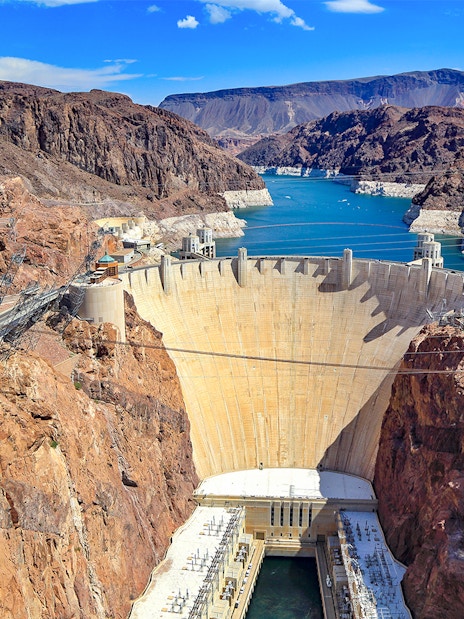 Hoover Dam with surrounding canyon and reservoir on exploration tour.