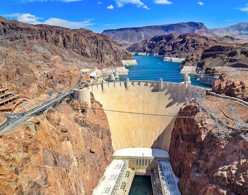 Hoover Dam with surrounding canyon and reservoir on exploration tour.