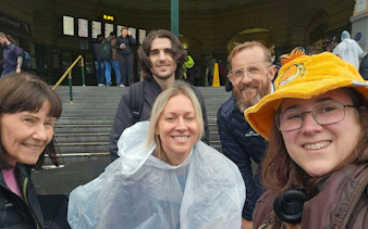 Group of people at Flinders Street Station, Melbourne, during the Forgotten Red Diamond city exploration game.