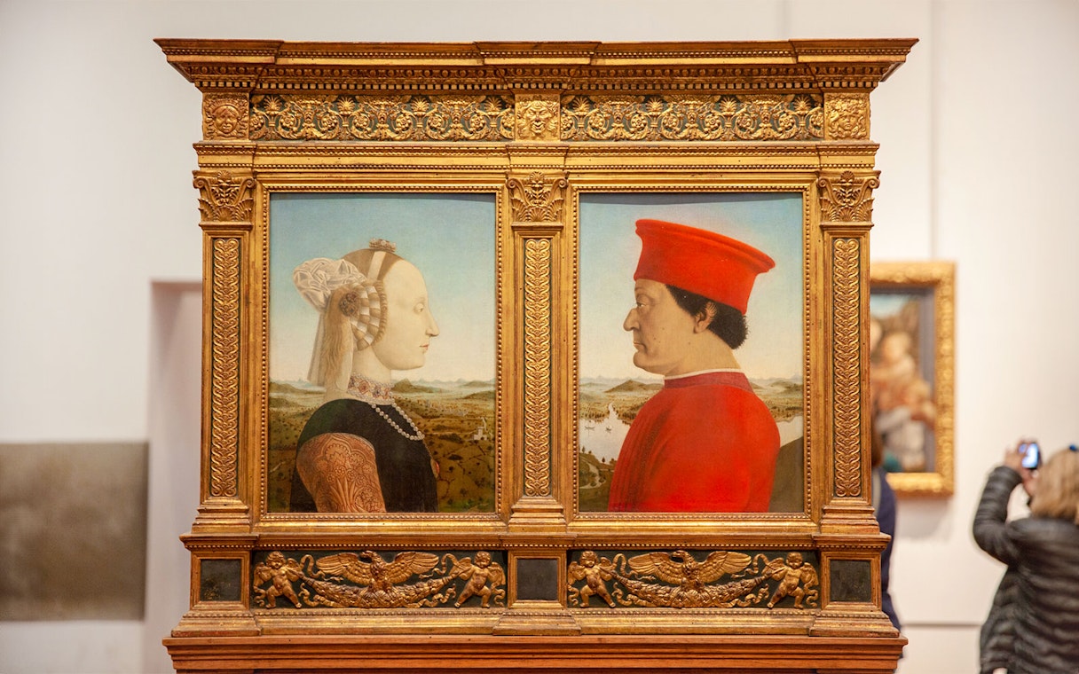 Portraits in ornate frame at Uffizi Gallery, Florence, part of Palazzo Vecchio Museum tour.