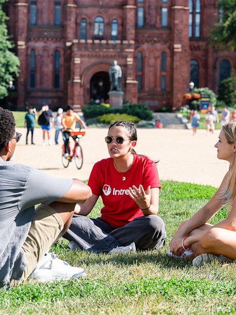 Tour group discussion on the lawn near Smithsonian Castle, Washington DC.