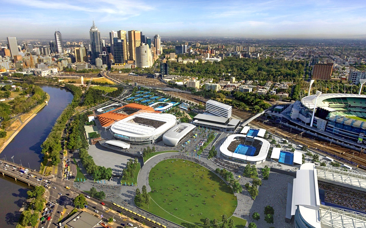 Aerial view of Melbourne sports precinct with stadiums and city skyline.