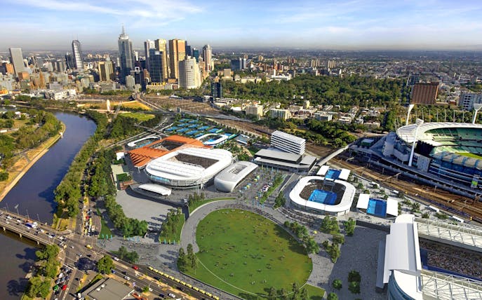 Aerial view of Melbourne sports precinct with stadiums and city skyline.