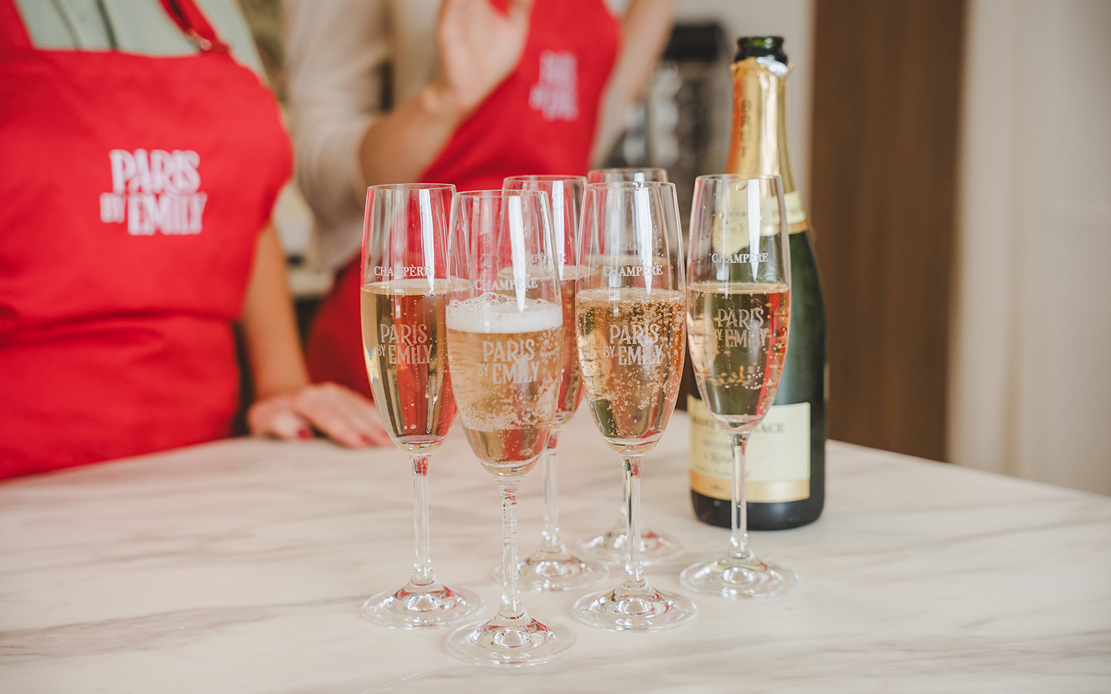 Champagne glasses at Emily in Paris Macaron-Making Workshop.