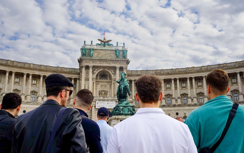 Tourists at Hofburg Palace in Vienna during a guided walking tour.