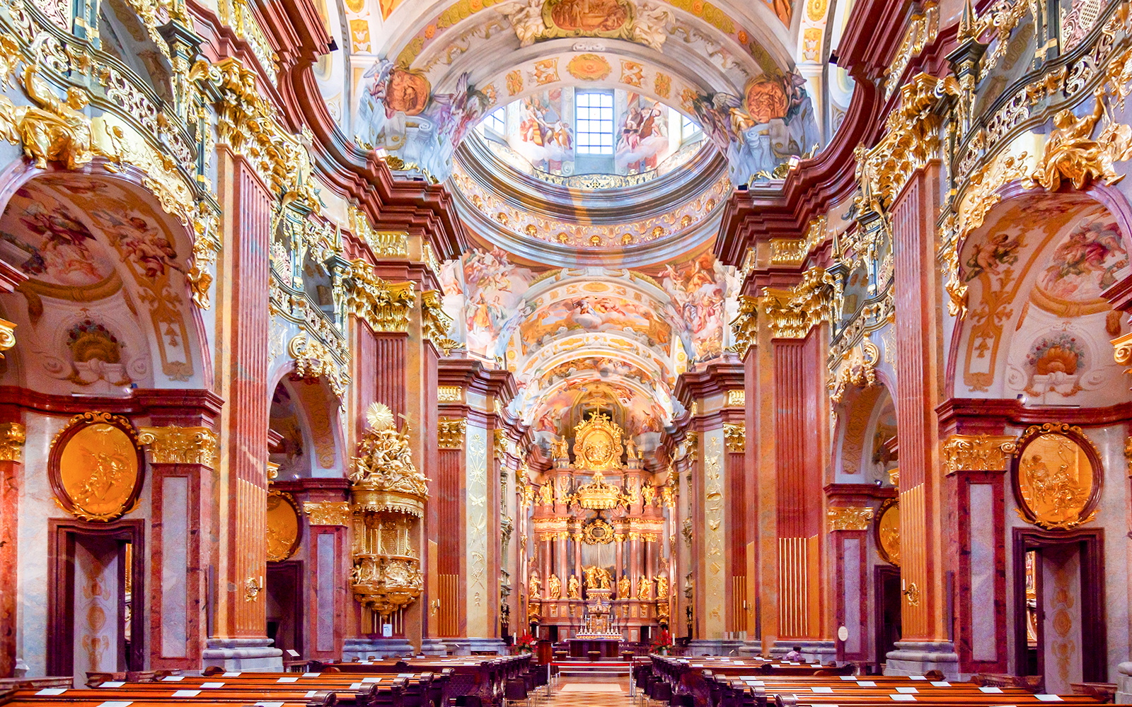Interior of Melk Abbey with ornate gold decorations, part of the Danube Valley day trip from Vienna.