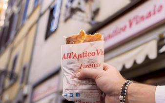 Hand holding sandwich from All’Antico Vinaio in Florence.