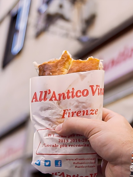 Hand holding sandwich from All’Antico Vinaio in Florence.