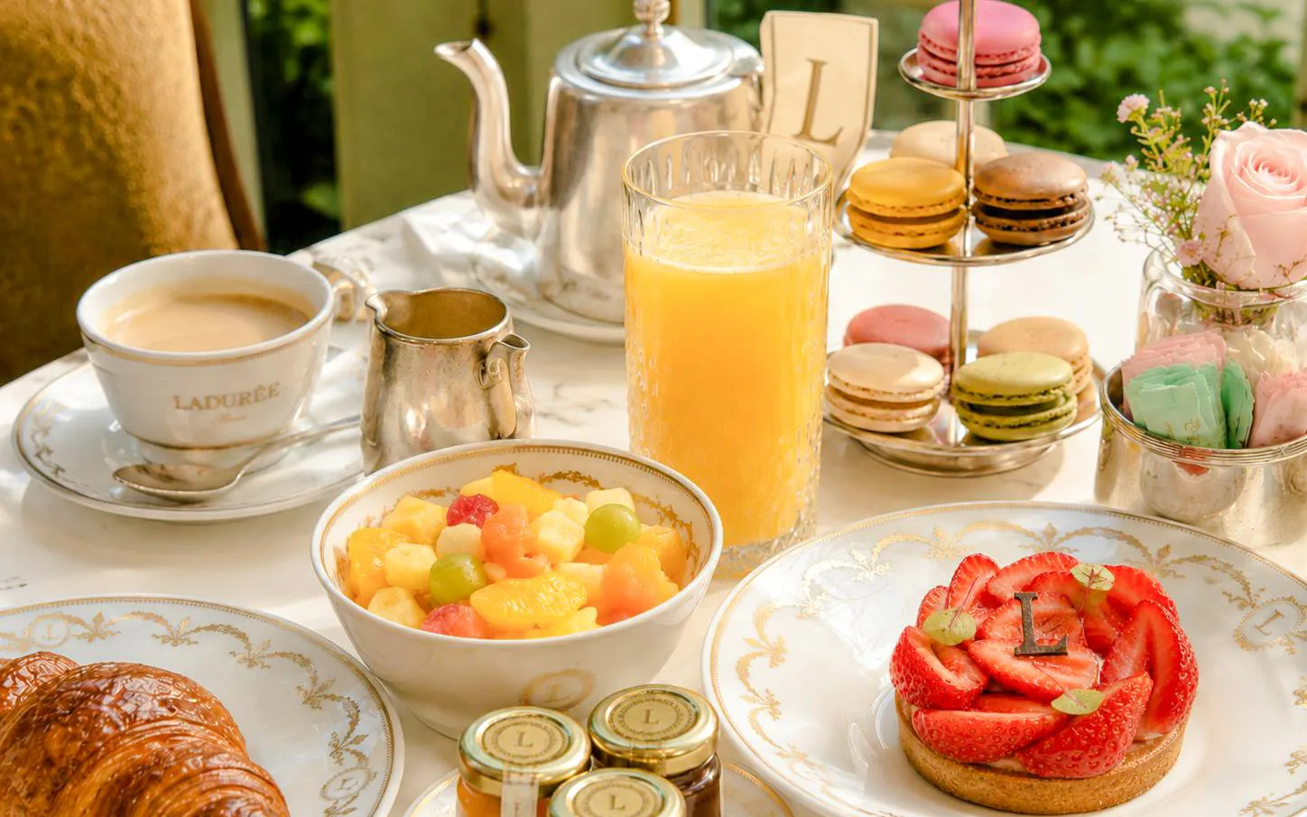 Ladurée tea set with pastries and macarons at Orsay Museum, Paris.