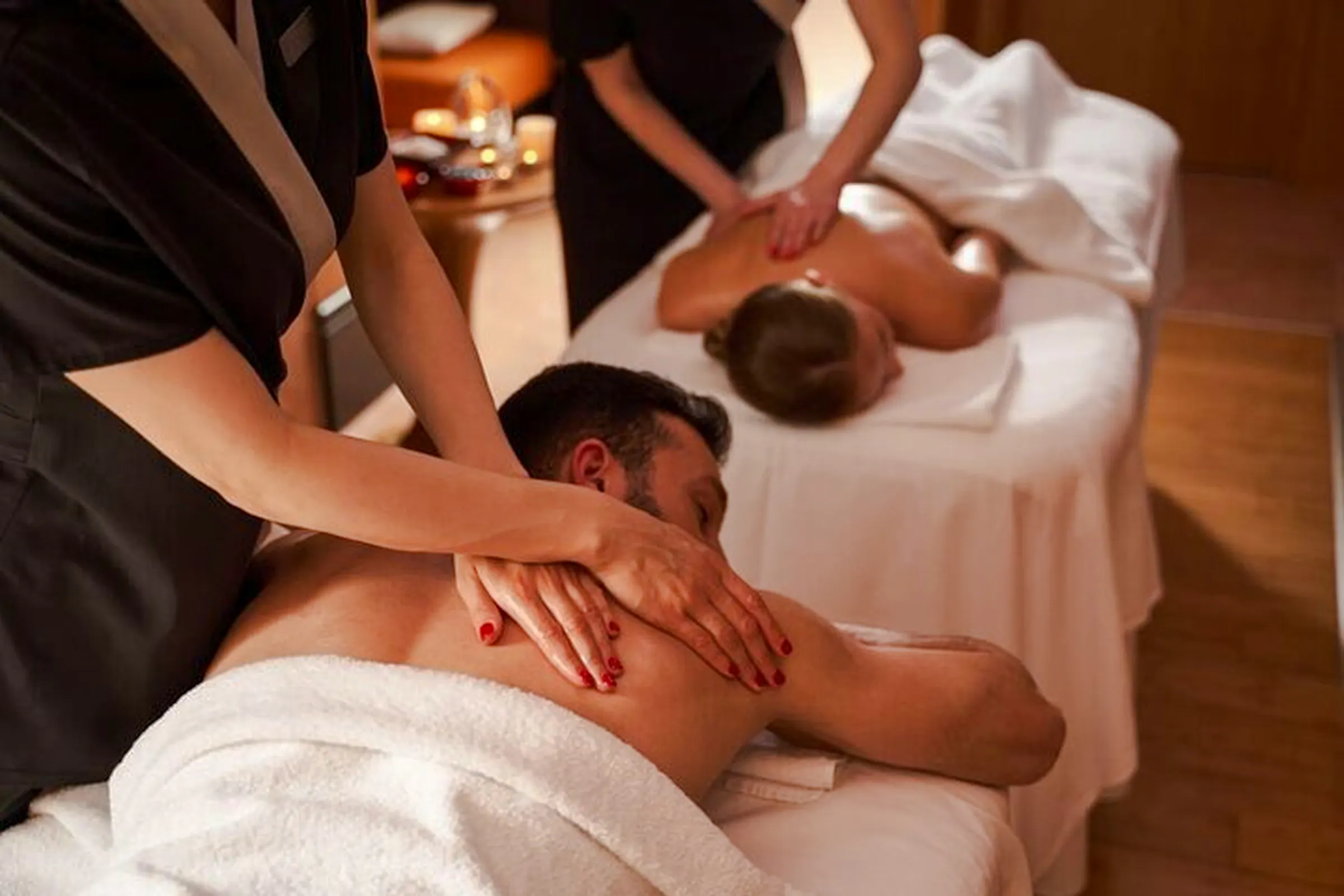 Traditional hammam massage session in Agadir spa with two people receiving treatments.