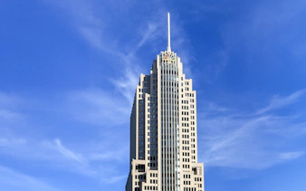 NBC Tower in Chicago against a clear blue sky.