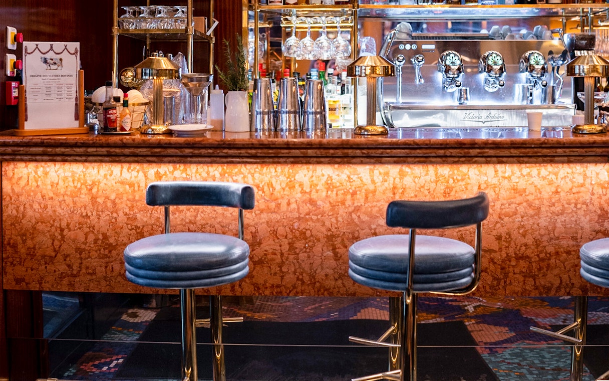 Bar counter with stools at Opéra-Grand Café Capucines, Paris.