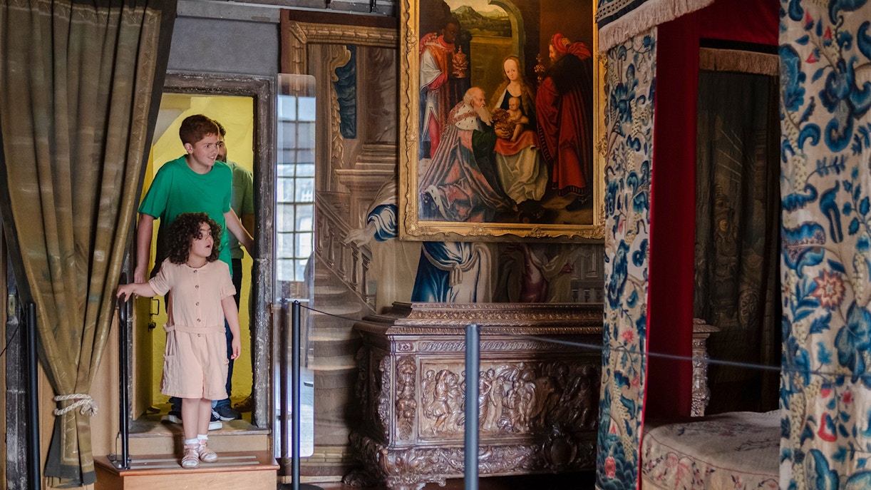 Visitors entering Mary Queen of Scots Bedchamber at the Palace of Holyroodhouse.