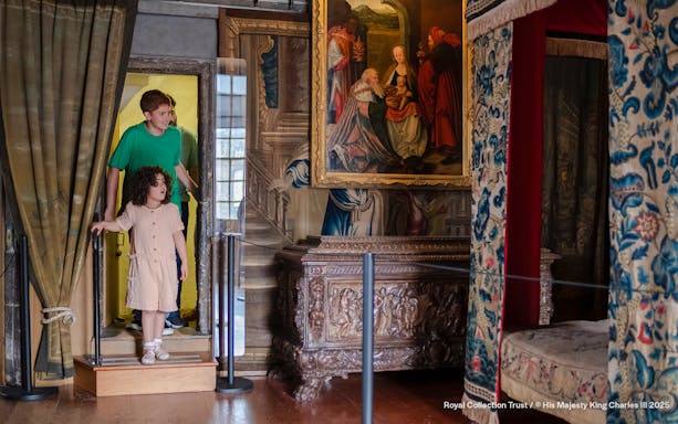 Visitors entering Mary Queen of Scots Bedchamber at the Palace of Holyroodhouse.