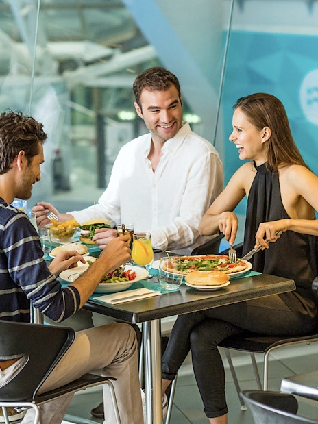 Group dining at Caldea spa restaurant, Andorra, enjoying meals by the pool.