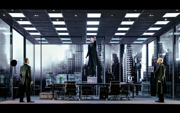 Stage scene from "The Lehman Trilogy" with actors in an office setting.