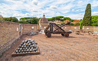 Catapult and cannonballs on Castel Sant'Angelo terrace, Rome, Italy.