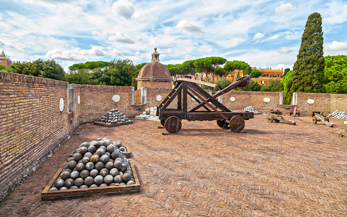 Catapult and cannonballs on Castel Sant'Angelo terrace, Rome, Italy.