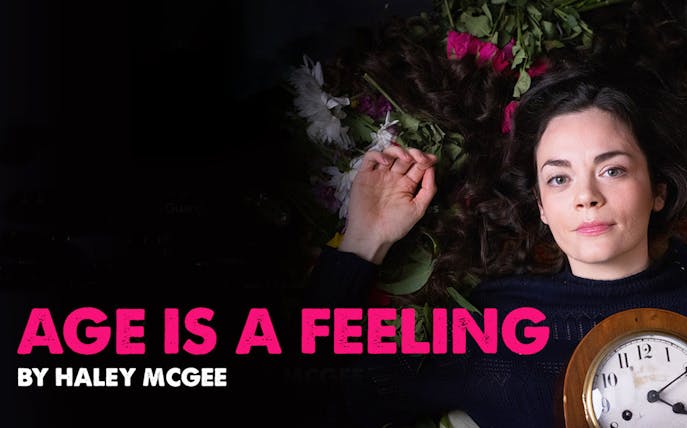 Person lying among flowers holding a clock, text reads 'Age Is A Feeling'