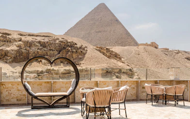 Dinner seating at Villa Khufu with view of the Great Pyramid in Giza, Egypt.
