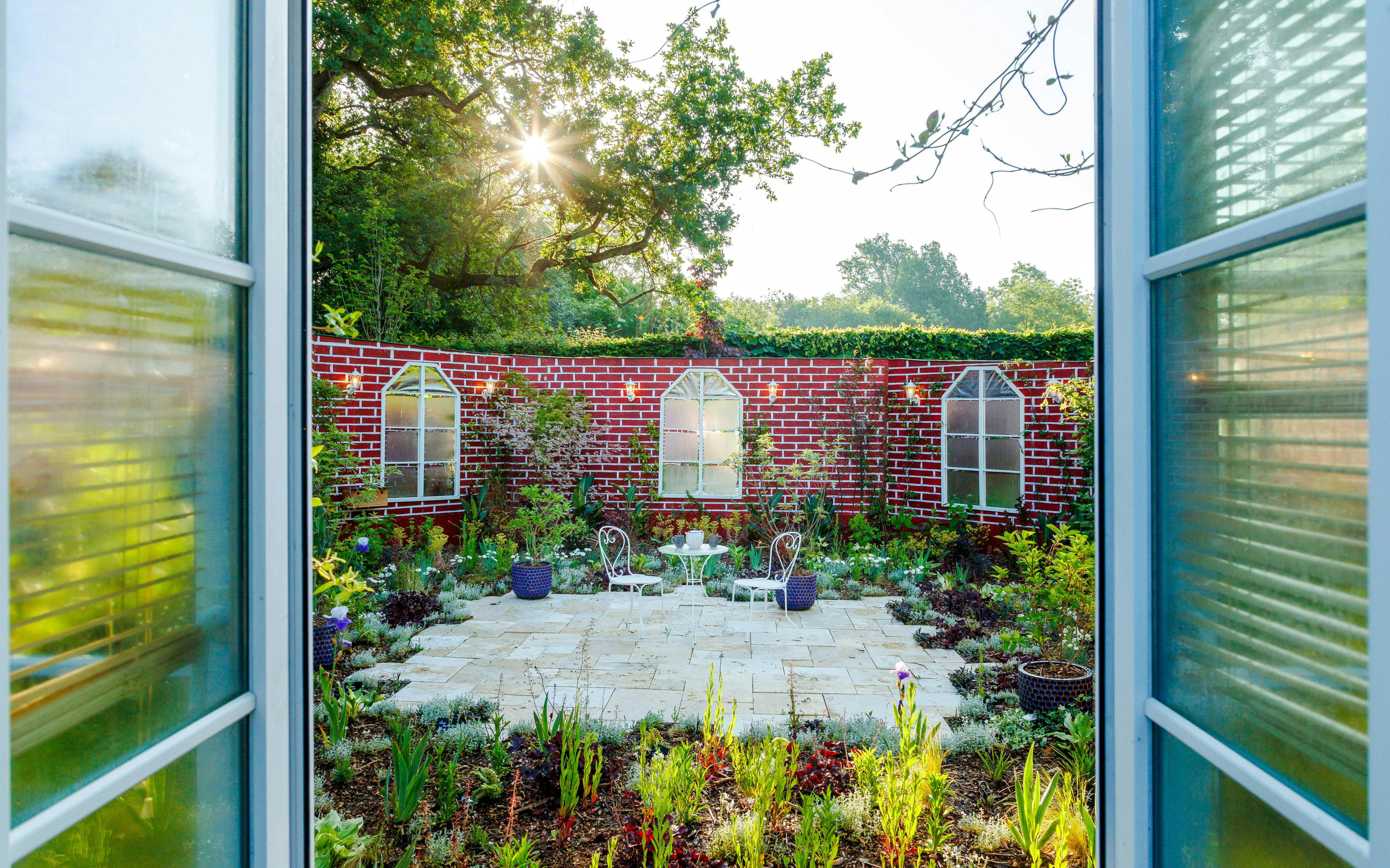 Garden view at Domaine du Chaumont-sur-Loire Castle, Loire Valley, with patio seating.